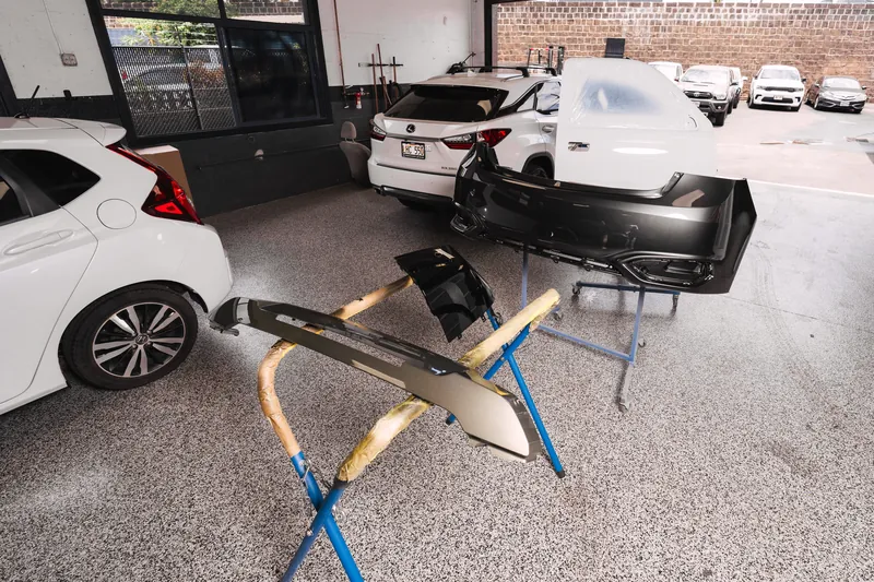 A bumper removed and staged for collision repair