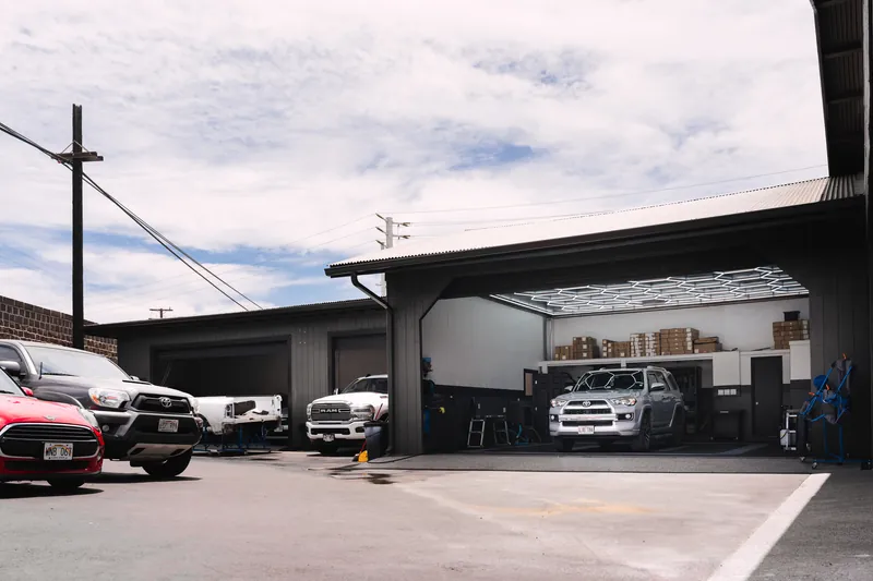 The 417 Autoworks building and open shop bay in Wailuku, Maui
