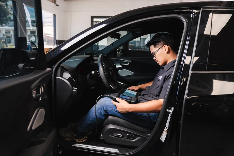 Running a post-repair diagnostic scan from the driver's seat